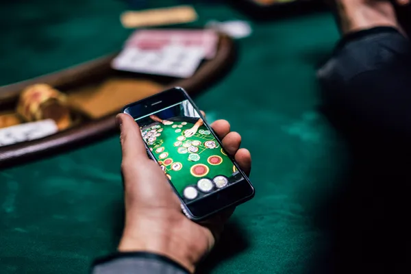 A glowing roulette wheel with cascading chips, symbolizing the engaging live and instant-win games available on 21GAME.